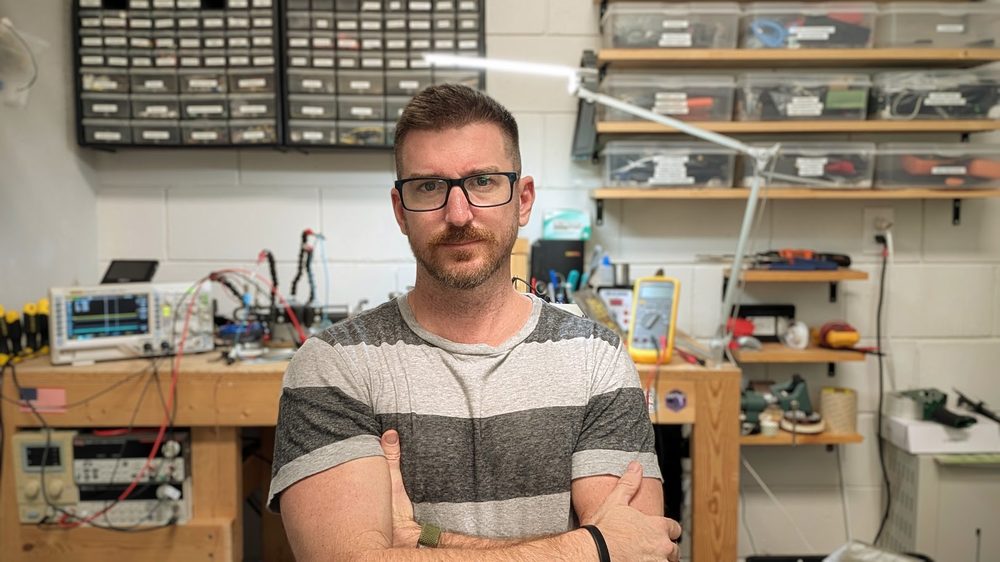 Craig Rettew, owner of Zepto Industries, at his electronics workbench