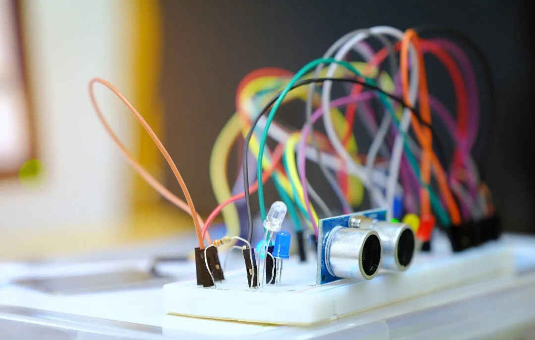 Breadboard prototype with an ultrasonic sensor, LEDs, and jumper wires